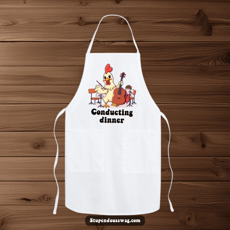 Funny apron with a rubber chicken attempting to conduct an orchestra, perfect for adding humor and a musical theme to cooking activities.