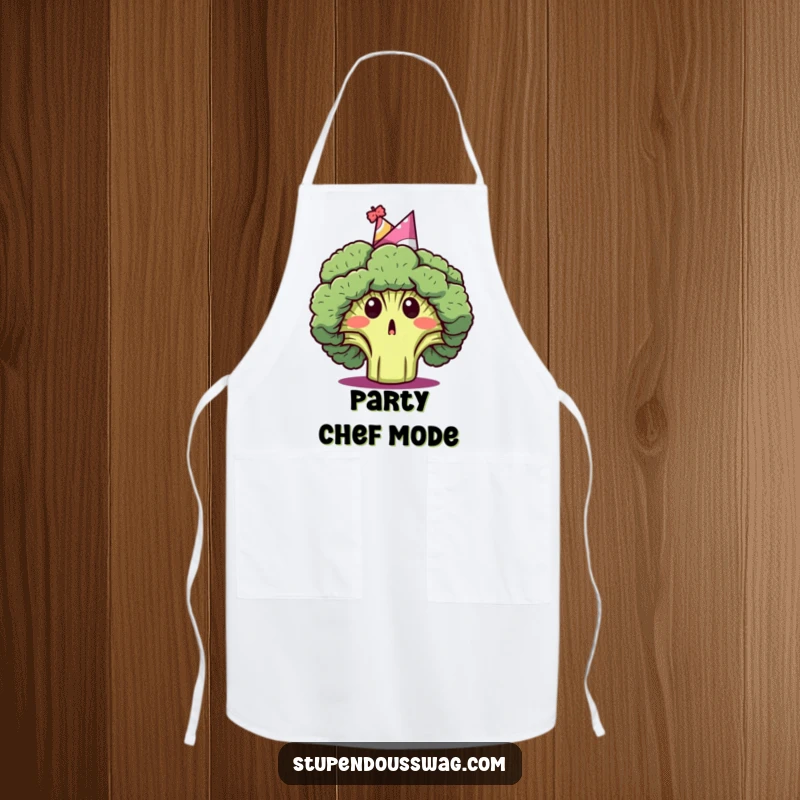 Funny apron depicting a surprised broccoli head wearing a party hat, a humorous and festive kitchen accessory.