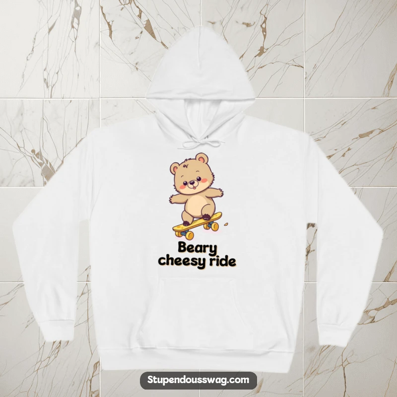 Funny hoodie depicting a clumsy bear cub struggling to ride a skateboard made of cheese, a humorous and relatable scene.