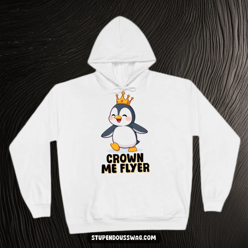 Funny hoodie with a penguin wearing a small crown, comically trying to fly, embodying big dreams.