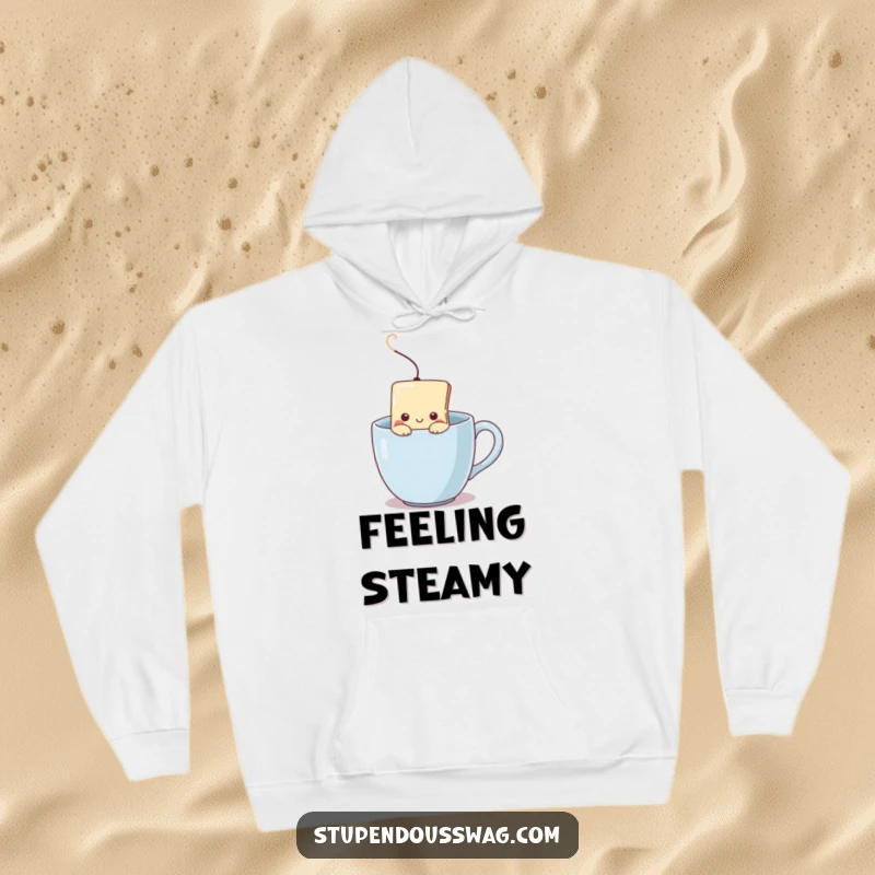 Funny hoodie with a shy teabag peeking from a steaming mug, symbolizing cozy introversion and the warmth of a comforting beverage.