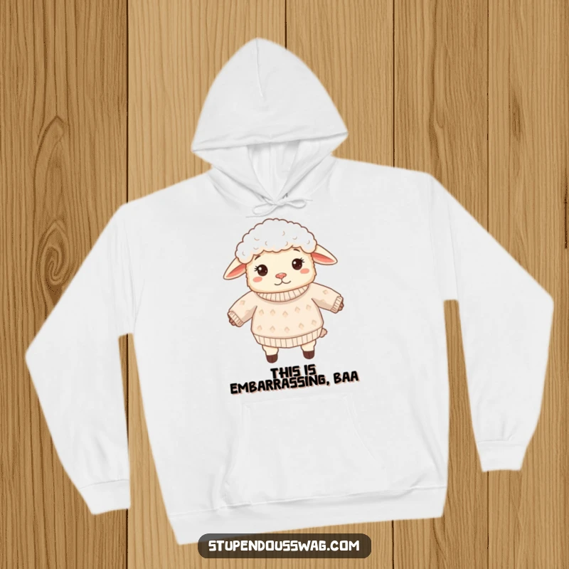 Funny sheep hoodie illustrating a fluffy sheep with an inside out sweater, displaying a perfectly confused and comical expression. Warm and witty apparel.