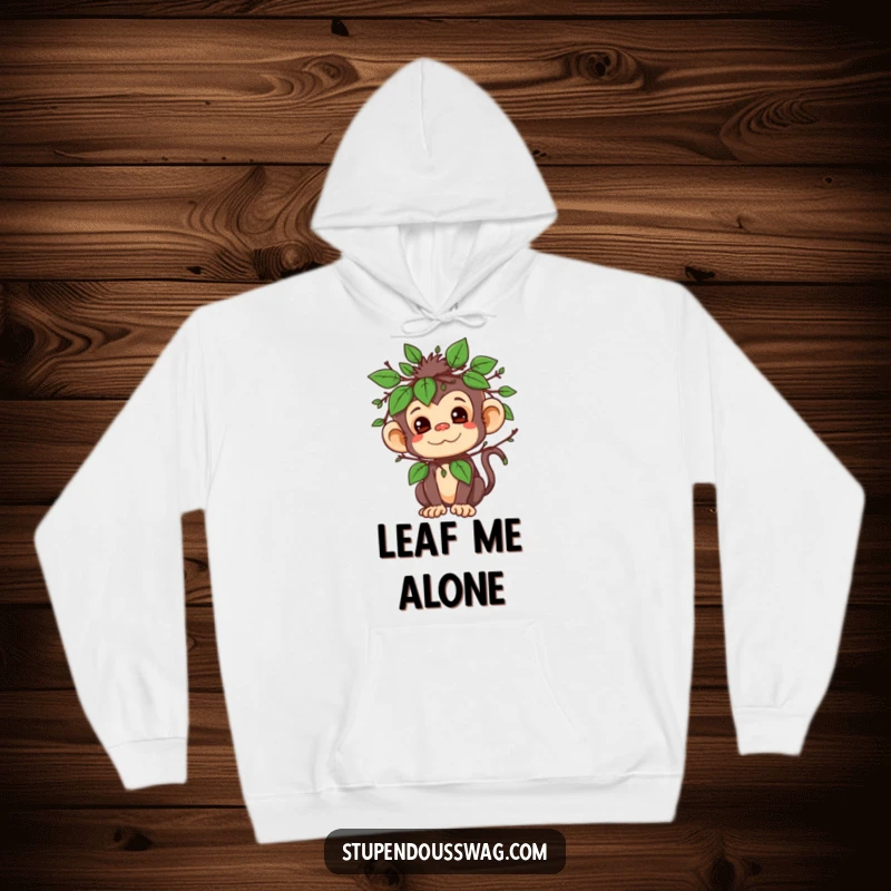 Funny hoodie featuring a mischievous monkey character cleverly disguised in leaves and twigs, ready for fun.