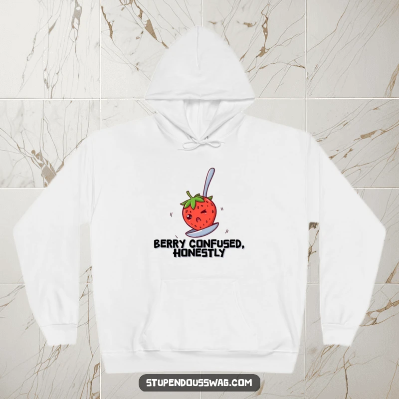 Funny hoodie showing a bewildered strawberry spinning rapidly on an upside-down spoon, perfect for staying warm with a touch of fruity fun.