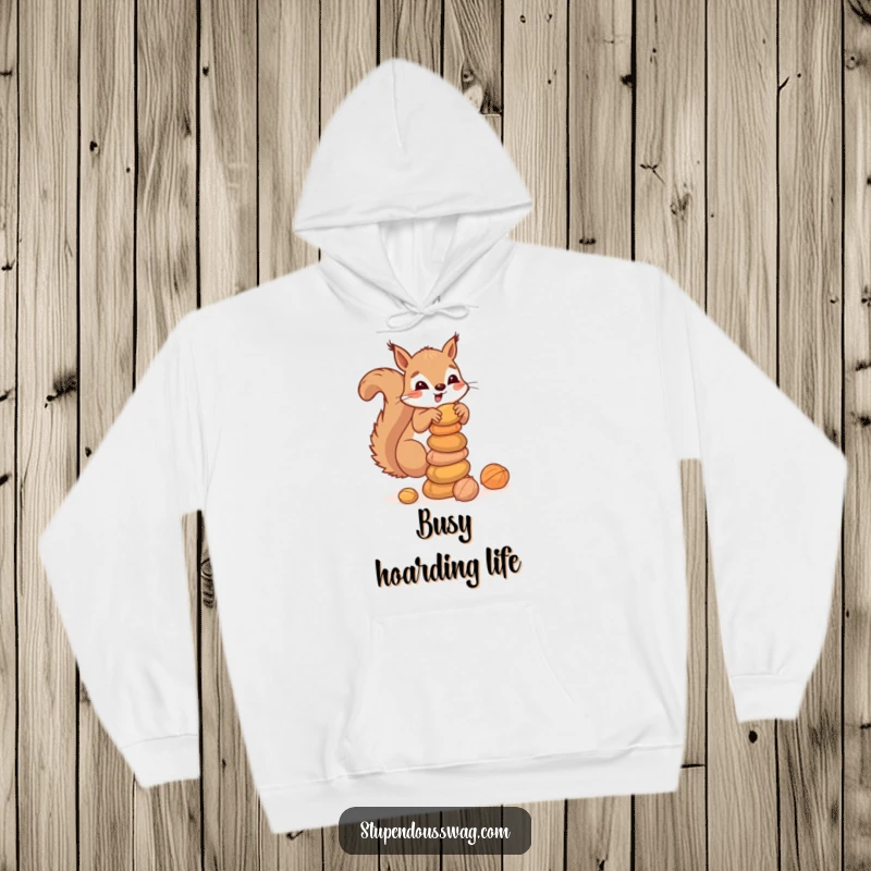 Funny hoodie depicting a clumsy squirrel balancing a stack of nuts, offering warmth and a dose of adorable, woodland-themed humor for casual wear.