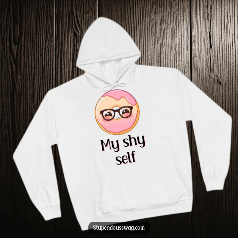 Funny hoodie featuring a shy donut wearing glasses, blushing sweetly, designed for ultimate cozy comfort and endearing charm.