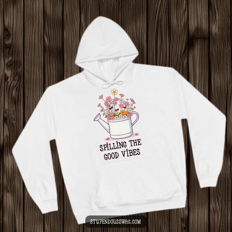 Funny hoodie with a giggling watering can overflowing with a shower of tiny, cheerful flowers, symbolizing joy and warmth.