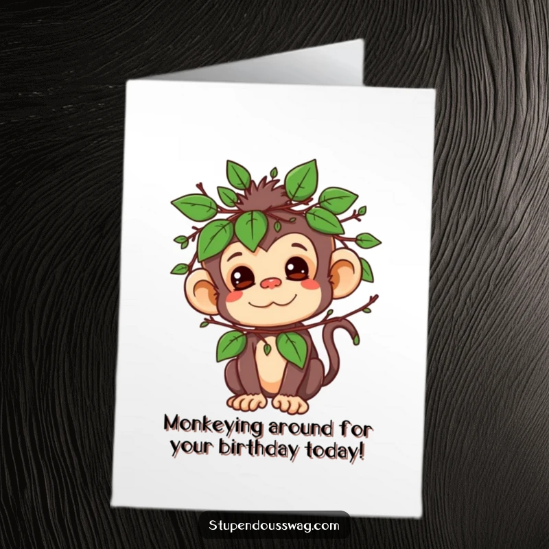 Funny free printable birthday card: A mischievous monkey hides behind a clever disguise of leaves and twigs, peeking out playfully.