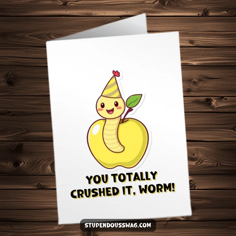 Funny Free Printable Congratulations Card: A cheerful worm in a party hat emerges victoriously from an apple, perfect for celebrating achievements.