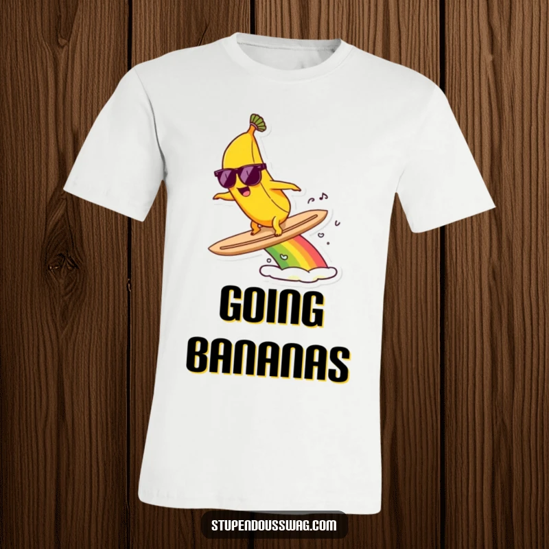 Funny t-shirt showcasing a banana wearing sunglasses, confidently surfing on a bright, arcing rainbow.