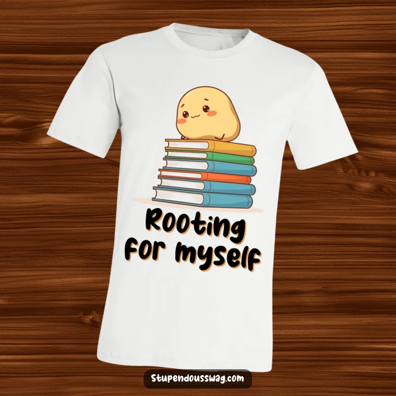 Funny t-shirt showcasing a tenacious potato scaling a precarious pile of books, embodying a comical struggle for learning.