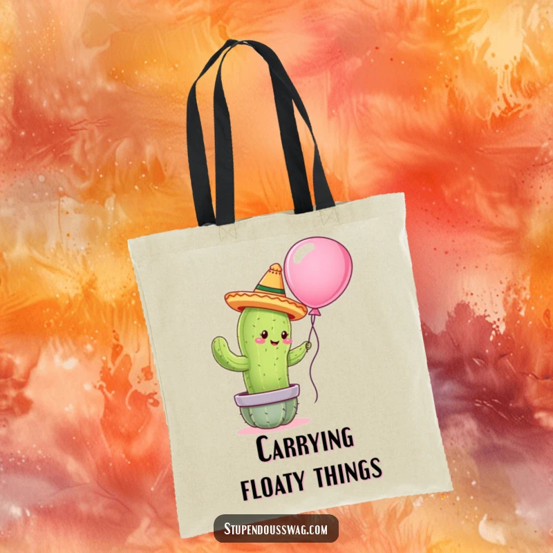 Funny tote bag with a cactus wearing a tiny sombrero attempting to hug a balloon, a practical and humorous accessory.