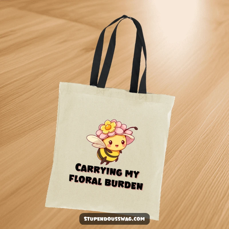 Funny tote bag with a tiny bee struggling to fly while wearing an oversized flower hat, for garden lovers.